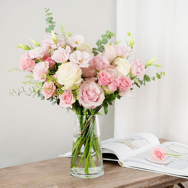 Bouquet of White Mondial Roses, Pink Mondial Roses, Pink Spray Roses, and Pink Lisianthus with Baby Eucalyptus and Thlaspi greeneries.