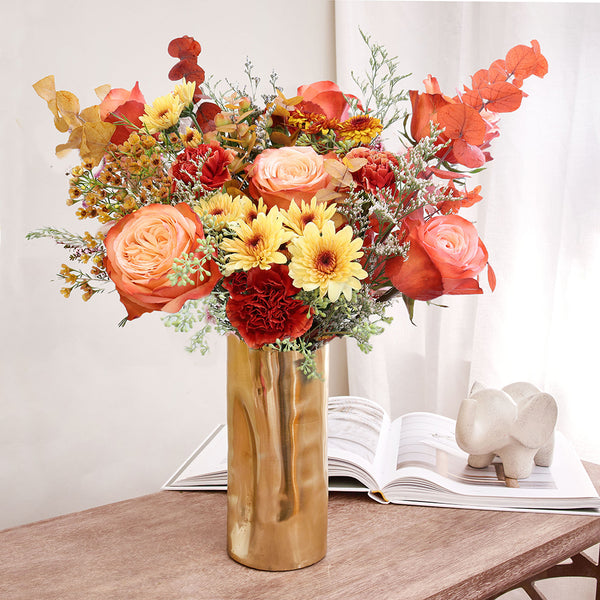 Bundle of Kahala Roses, Wax Flowers, Caspia, Pompoms and Specialty Carnations with Seeded and Rainbow Eucalyptus greeneries.